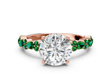 Rose gold Round Cut Diamond Side Stone Solitaire Ring with Round with Emerald side stone and Four-Prong Setting