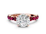 Rose gold Round Cut Diamond Side Stone Solitaire Ring with Round with Garnet side stone and Four-Prong Setting