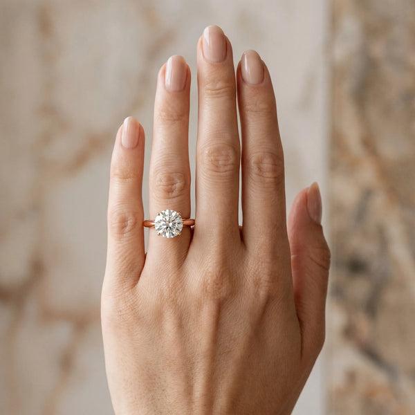 Rose gold Round Cut Diamond Solitaire Engagement Ring with Cathedral Setting and Four-Prong Mount