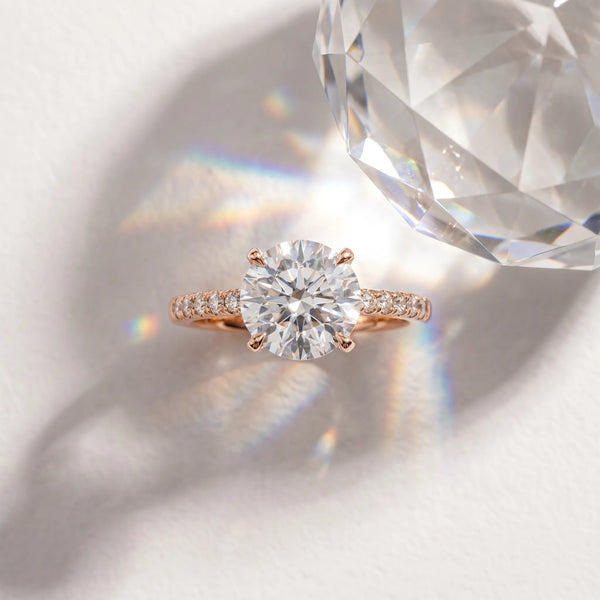 Rose gold Round Cut Diamond Solitaire Engagement Ring with Cathedral Setting and Four-Prong Mount