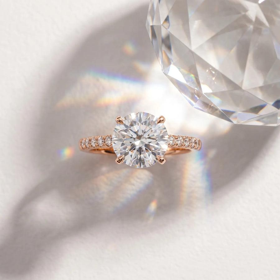 Rose gold Round Cut Diamond Solitaire Engagement Ring with Cathedral Setting and Four-Prong Mount