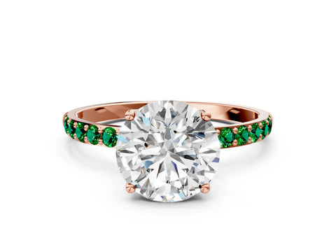 Rose gold Round Cut Diamond Solitaire Engagement Ring with Round with Emerald side stone Pavé Band and Prong Setting
