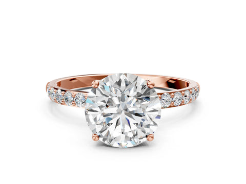 Rose gold Round Cut Diamond Solitaire Engagement Ring with Round with Moissanite side stone Pavé Band and Prong Setting