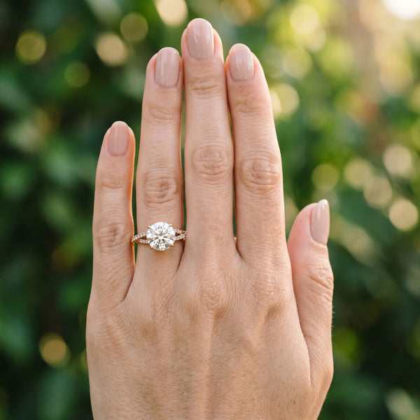 Rose gold Round Cut Diamond Solitaire Engagement Ring with Twisted Pavé Band and Four-Prong Setting