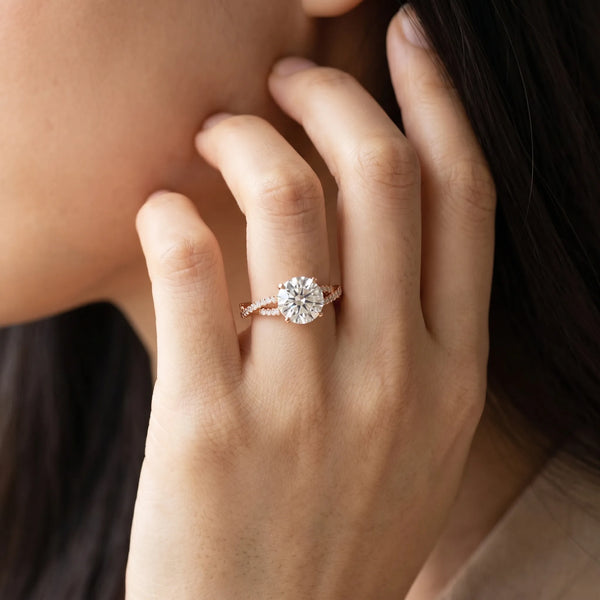 Rose gold Round Cut Diamond Solitaire Engagement Ring with Twisted Pavé Band and Four-Prong Setting