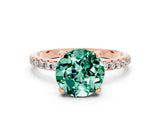 Rose gold Round Cut Diamond Solitaire Ring with Four-Prong Setting and Pavé Band