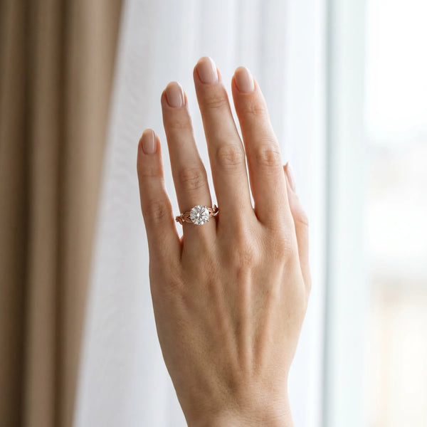 Rose gold Round Cut Diamond Solitaire Ring with Leaf Motif Band and Four-Prong Setting