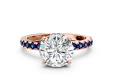 Rose gold Round Cut Diamond Solitaire Ring with Round with Blue Sapphire side stone Pavé Band and Four-Prong Setting_36