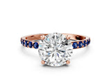 Rose gold Round Cut Diamond Solitaire Ring with Round with Blue Sapphire side stone Pavé Band and Prong Setting_12