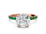 Rose gold Round Cut Diamond Solitaire Ring with Round with Emerald side stone Pavé Band and Prong Setting_24