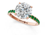Rose gold Round Cut Diamond Solitaire Ring with Round with Emerald side stone Pavé Band and Prong Setting_25