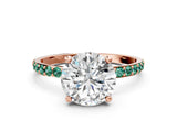Rose gold Round Cut Diamond Solitaire Ring with Round with Green Sapphire side stone Pavé Band and Prong Setting