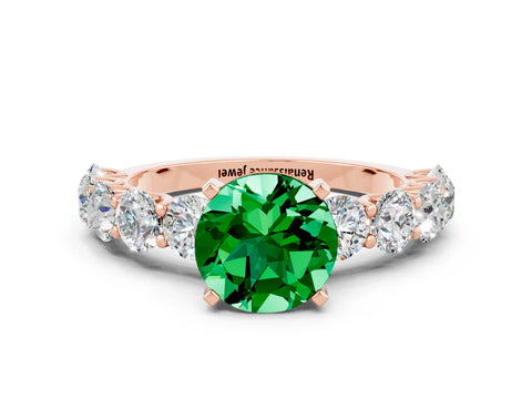 Rose gold Round Cut Emerald Prong Setting with Side Stones on a Pave Band