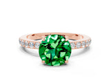 Rose gold Round Cut Emerald Solitaire Engagement Ring with Pavé Band and Four-Prong Setting