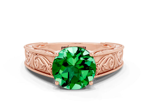 Rose gold Round Cut Emerald Solitaire Ring with Engraved Band and Four-Prong Setting