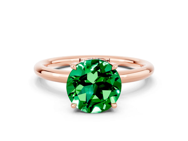 Rose gold Round Cut Emerald Solitaire Ring with Thin Band and Four-Prong Setting