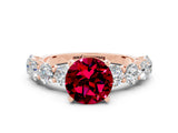 Rose gold Round Cut Garnet Prong Setting with Side Stones on a Pave Band