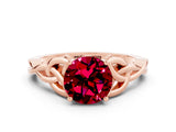 Rose gold Round Cut Garnet Solitaire Engagement Ring with Celtic Knot Band and Four-Prong Setting