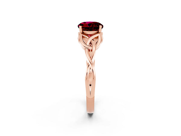 Rose gold Round Cut Garnet Solitaire Engagement Ring with Celtic Knot Band and Four-Prong Setting