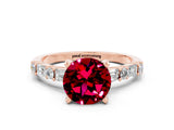 Rose gold Round Cut Garnet Solitaire with Side Baguettes and Channel Set Band