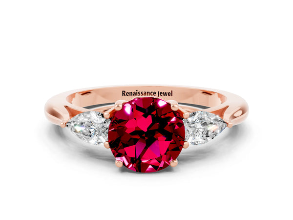 Rose gold Round Cut Garnet Three-Stone Ring with Pear  Side Stones and Prong Setting