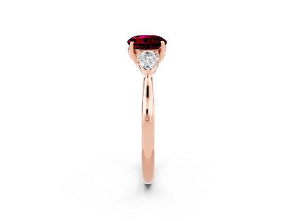 Rose gold Round Cut Garnet Three-Stone Ring with Pear  Side Stones and Prong Setting