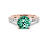 Rose gold Round Cut Green Sapphire Solitaire with Side Baguettes and Channel Set Band