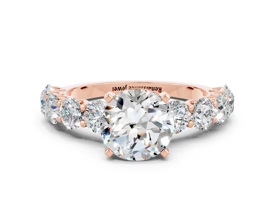 Rose gold Round Cut Moissanite Prong Setting with Side Stones on a Pave Band