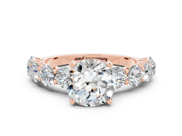 Rose gold Round Cut Moissanite Prong Setting with Side Stones on a Pave Band