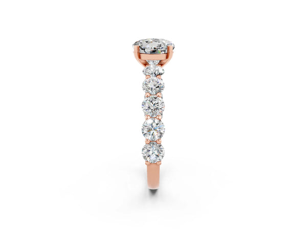Rose gold Round Cut Moissanite Prong Setting with Side Stones on a Pave Band