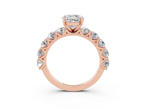 Rose gold Round Cut Moissanite Prong Setting with Side Stones on a Pave Band