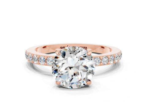 Rose gold Round Cut Moissanite Ring with Pavé Band and Four-Prong Setting