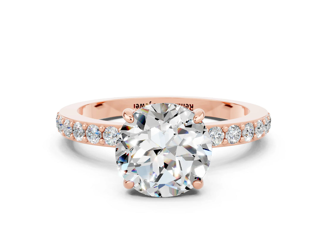 Rose gold Round Cut Moissanite Solitaire Engagement Ring with Pavé Band and Four-Prong Setting