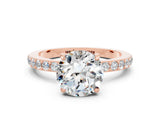 Rose gold Round Cut Moissanite Solitaire Engagement Ring with Pavé Band and Four-Prong Setting
