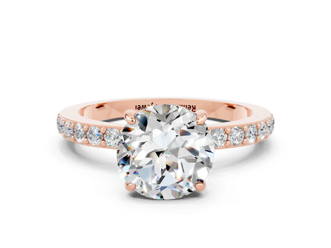 Rose gold Round Cut Moissanite Solitaire Engagement Ring with Pavé Band and Four-Prong Setting