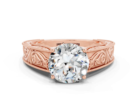 Rose gold Round Cut Moissanite Solitaire Ring with Engraved Band and Four-Prong Setting