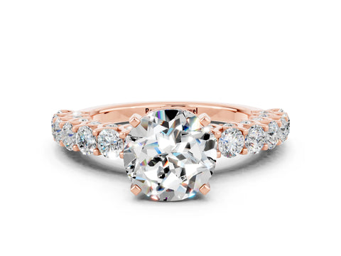 Rose gold Round Cut Moissanite Solitaire Ring with Shared Prong Pavé Band and Four-Prong Setting