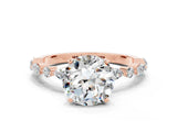 Rose gold Round Cut Moissanite Solitaire with Side Stones on a Pavé Band and Four-Prong Setting