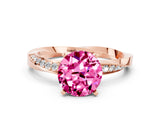Rose gold Round Cut Pink Sapphire Engagement Ring with Side Stone Accents and Four-Prong Setting_51