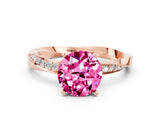 Rose gold Round Cut Pink Sapphire Engagement Ring with Side Stone Accents and Four-Prong Setting_60