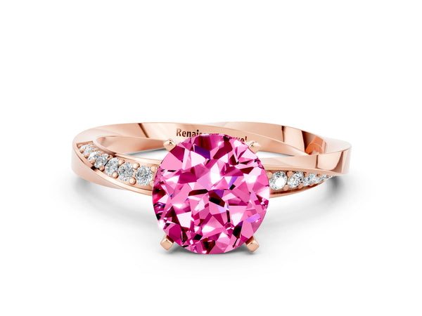 Rose gold Round Cut Pink Sapphire Engagement Ring with Side Stone Accents and Four-Prong Setting
