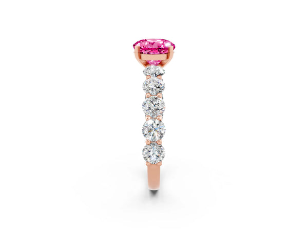Rose gold Round Cut Pink Sapphire Prong Setting with Side Stones on a Pave Band