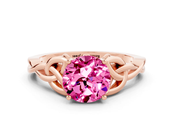 Rose gold Round Cut Pink Sapphire Solitaire Engagement Ring with Celtic Knot Band and Four-Prong Setting