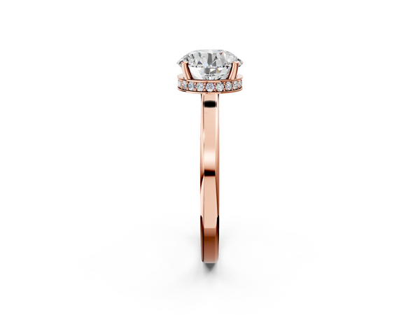 Rose gold Round Cut Solitaire Engagement Ring with Four-Prong Setting on a Classic Band