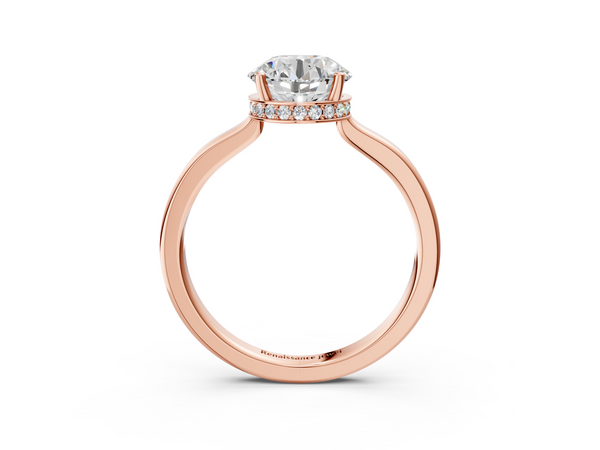 Rose gold Round Cut Solitaire Engagement Ring with Four-Prong Setting on a Classic Band