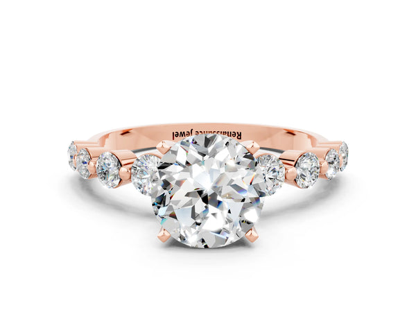 Rose gold Round Cut Solitaire Moissanite Ring with Pave Band and Four-Prong Setting