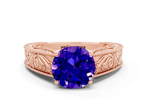 Rose gold Round Cut Tanzanite Solitaire Ring with Engraved Band and Four-Prong Setting