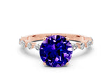 Rose gold Round Cut Tanzanite Solitaire with Side Stones on a Pavé Band and Four-Prong Setting