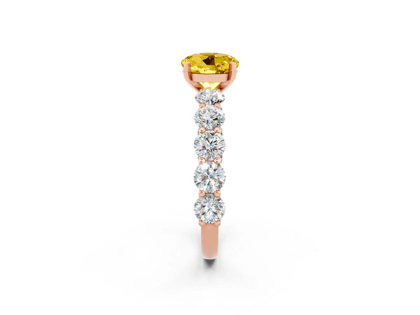 Rose gold Round Cut Yellow Sapphire Prong Setting with Side Stones on a Pave Band