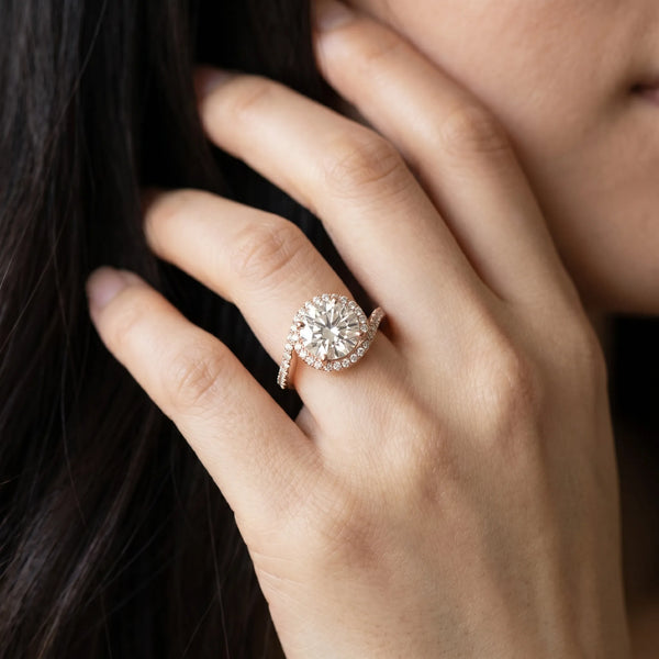 Rose gold Round Diamond Halo Ring with Twisted Pavé Band and Four-Prong Setting